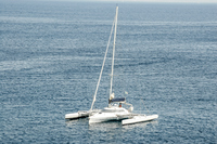 <p>a yacht with three hulls in parallel</p>