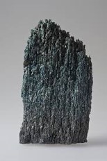 <p><span style="font-size: 12.8px; font-family: lato, sans-serif">a mineral with vitreous luster, is dark green/black in color (mafic), grey/white streak, hardness of 5/6</span></p>