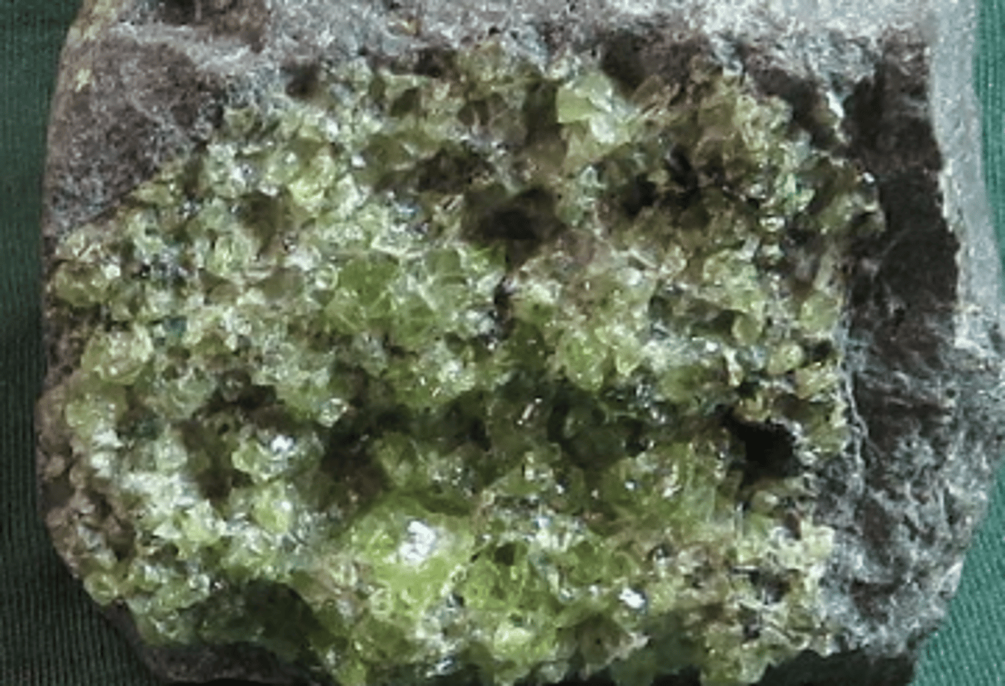 <p>Mafic Mineral (dark in color and high density) <br>high concentrations of some combination of iron, magnesium, calcium, and titanium. They tend to have low concentrations of silica, sodium, aluminum, and potassium</p>