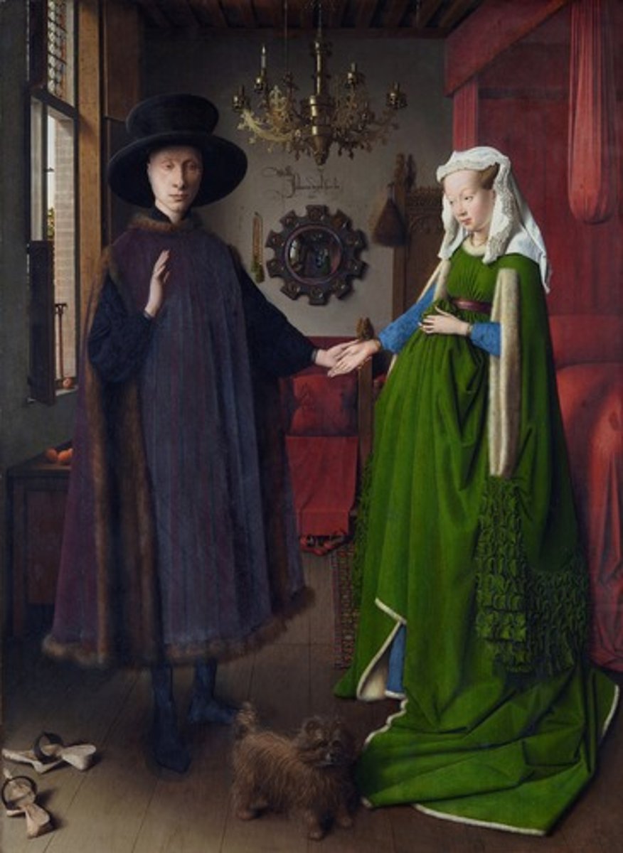 <p>The Arnolfili Portrait.<br>Jan van Eyck. 1434. Oil on wood<br>Lots of theories:<br>Wedding or bethroval<br>Memorial to dead wife<br>Transfering buisness or finicnail responsibility<br>The Arnolfini family (wealthy merchant) are showing off their wealth or receiving guests.<br>Wedding: Candle (wedding night), shoes cast away (holy ground), dog (fidelity)<br>Religious symbolism: single candle on chandelier (gods presense), prayer beads on wall, mirror scenes have bible scenes.<br>Fertility/childbirth: dress pulled up, statue of st margaret (patron of childbirth) on bed.<br>Wealth: oranges on table, carpet on ground, lavish furs and fabrics.<br>Man near window (life=outisde) wife in the home (domestic)<br>Jan van eyck painted himself into the painting<br>Aritst understands perspective and glazes to reate realistic textures</p>