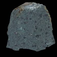 <p>-igneous</p><p>-volcanic</p><p>-aphanitic, porphyritic, vesicular, amydgoloidal</p><p>-intermediate</p><p>-Ca/Na plagiocalse, pyroxene, hornblende</p><p>-forms in the middle of BRS</p><p>uses: construction</p>