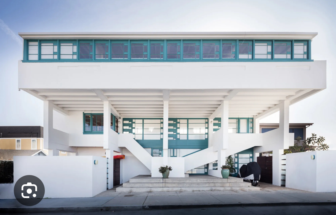 <p><span><span>Exposed concrete frames, beachfront setting</span></span></p>