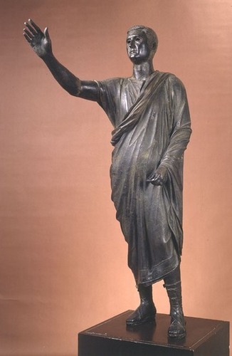 <p>Period: Roman Republic</p><p style="text-align: left;">Material: bronze</p><p style="text-align: left;">Signifcance: Orator pose symbolizes power through dialouge. Example of <em>verism</em>—Roman realism that emphasizes wisdom and authority through age</p>