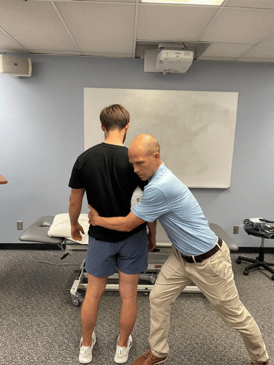<p>extension bias</p><p>wide BOS</p><p>stabilize pt’s trunk with therapist’s hands, using pt’s bent arm held into rib cage</p><p>wrap arms around pt’s pelvis, pull hips toward you</p><p>may be oscillatory (slow) or sustained</p>