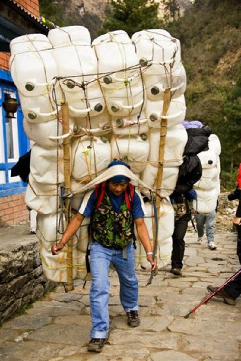 <p>large or heavy and therefore difficult to carry or use; unwieldy./slow or complicated and therefore inefficient.</p>