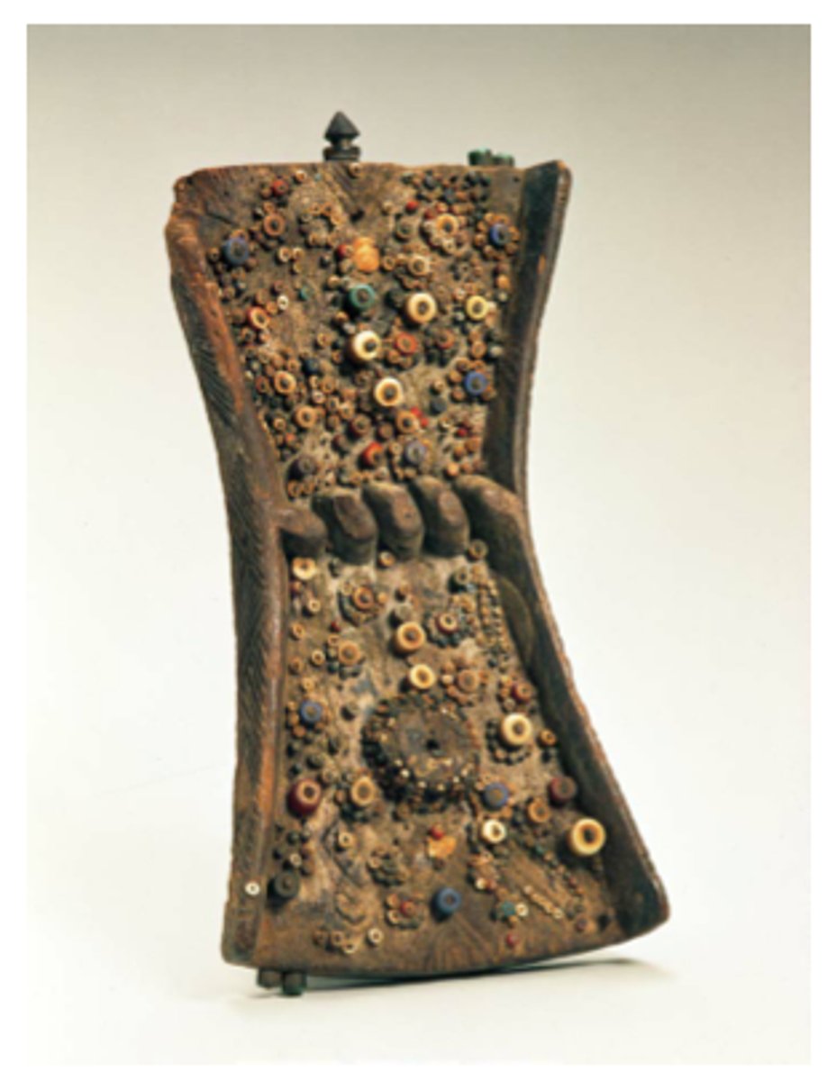 <p>Mbudye Society, Luba People (Democratic Republic on the Congo)</p><p>c. 19th to 20th century CE</p><p>Form: Wood, beads, and metal</p><p>Function: Serves as a set of symbols in lieu of a written tradition</p><p>Each Lukasa is unique and is made of wood, shells, metal and beads. They help the reader recall and recite the story of heroes, kingship, migrations and genealogy. Memory boards are controlled and read by members of the Mbudye society. The reader would hold the Lukasa in one hand, while using the free hand to trace the embedded objects. As each object is traced with a finger, the reader tells that part of the story. The beads and objects act as mnemonic devices or memory triggers</p>