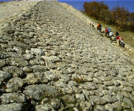 <ol><li><p>Glacis - defense fortification, harmonious continouation fo the mountain itself</p></li><li><p>Cyclopean walls - giant polygonal stones stacked without adhesive material, yet they stood well</p></li><li><p>Postern Gates</p></li></ol><p>(glacis shown in the picture)</p>