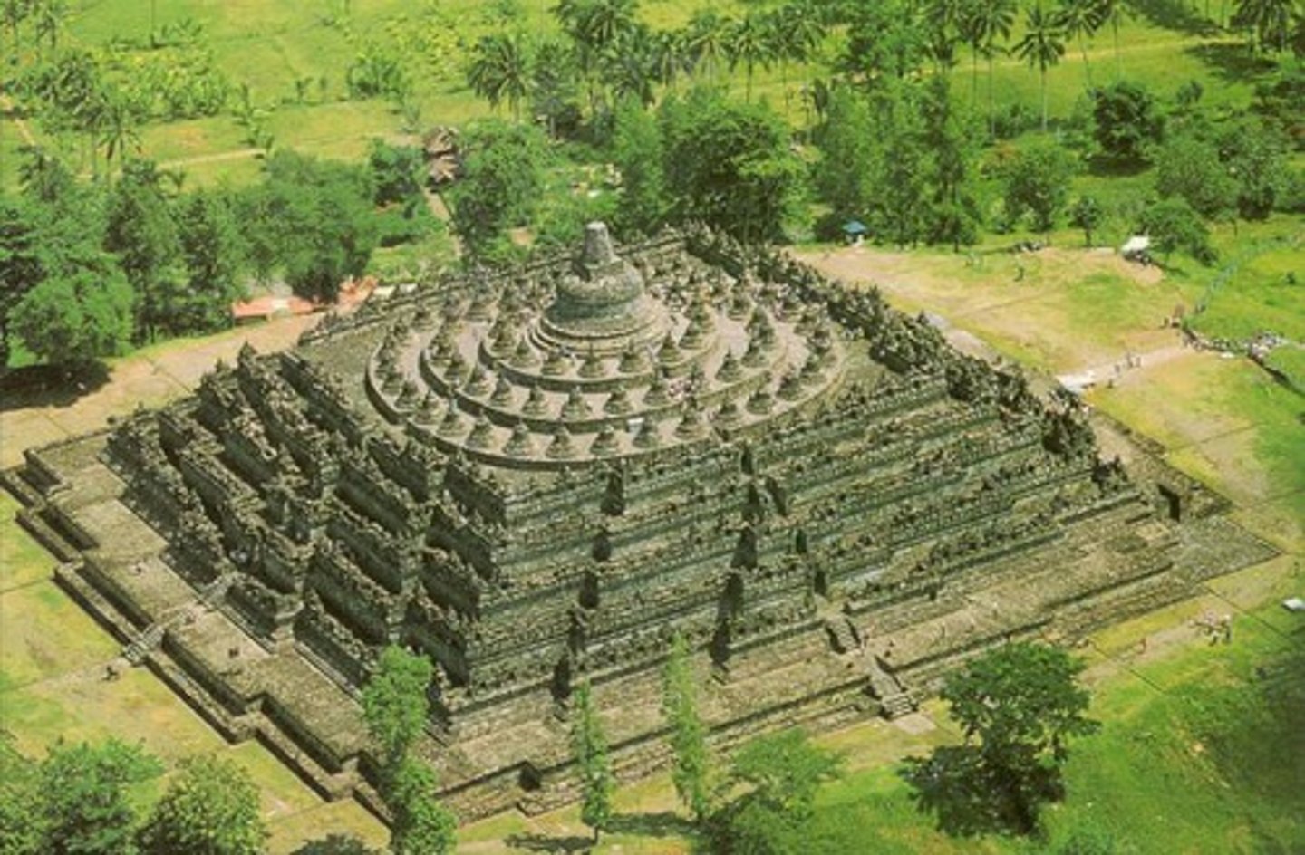 <p>750-842 CE. Stone masonry (VOLCANIC BTW? CRAZY) Java, Indonesia (OMG CULTURAL SPREAD)<br>LARGEST BUDDHIST TEMPLE!!!!<br>PILGRIMAGE SITE<br>9 tiers, each to be circumambulated. Lower 6 are squares, upper 3 are circular, TOP IS A HUGE STUPA<br>Also.. HAS OVER 500+ BUDDHA STATUES and 1500 STUPAS!! More than a mile ½ of relief sculptures<br>Budhhas are CROSS LEGGED + Preaching mudra hand symbol<br>Aligns with 4 cardinal directions<br>Aligned with buddhist cosmology. Lower floors = DESIRES, Middle world (world of forms) and top floors = spiritual world, FREE OF DESIRE! (formless)<br>Pilgrimage UP is supposed to represent ENLIGHTENMENT , just like one massive stupa it represents a mini world<br>Queen Maya riding a horse carriageIN BOROBUDUR!!<br>Before his birth<br>DENSELY PACKED FIGURES (horror vacui)<br>Queen is at rest, to give birth to buddha<br>DIDACTIC CONTAINS NARRATIVE RELIEF SCULPTURES!</p>