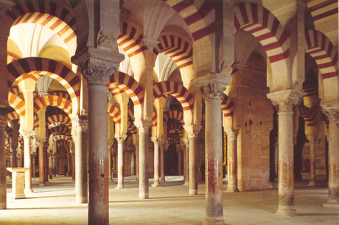 <p>Horseshow arch, geometric designs, more focus on the enclosed spaces and interior rather than exterior screens</p>