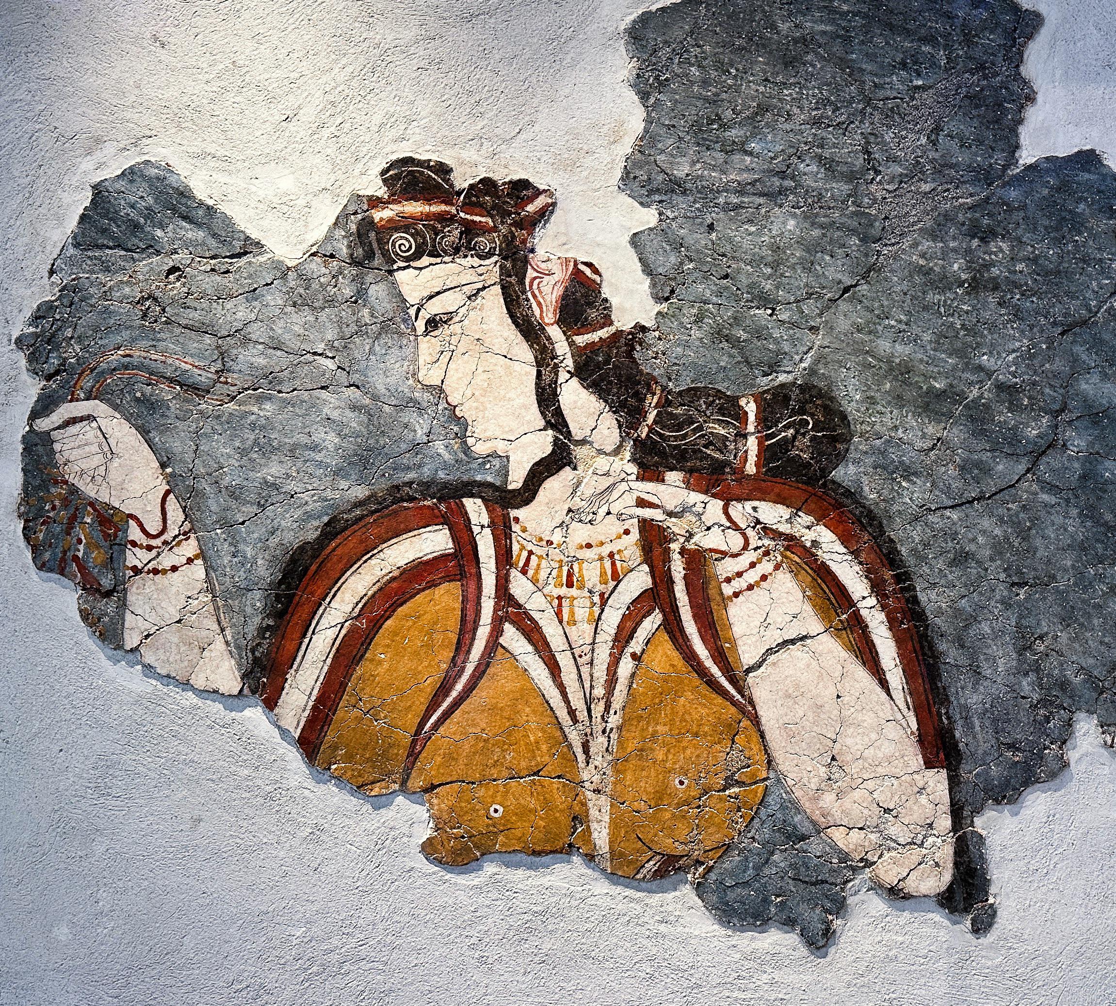 <p><strong><u>Date</u></strong> : 13th century BC</p><p><strong><u>Location</u></strong> : House of the Chief Priest, Mycenae</p><p><strong><u>Material</u></strong> : plaster and paint</p><p><strong><u>Details</u></strong> :</p><ul><li><p><strong>patterned cuts and strands at the front</strong> - evidence of <strong>women’s hair, appearance</strong></p></li></ul><p></p><ul><li><p>Many colours used : <strong>Black, red, white, yellow</strong></p></li></ul><p></p><ul><li><p><strong>Short sleeved blouse with red + white stripes</strong> on the shoulders and around chest - <strong>accentuates her body shape</strong> ( typical of <strong>Mycenaean female depictions</strong> )</p></li></ul><p></p><ul><li><p><strong>Pendant necklace</strong> with <strong>red</strong> and <strong>beads</strong>, <strong>necklace</strong> ( <strong>red + yellow beads</strong> ) <strong>- Amber stones</strong> !</p></li></ul><p></p><p><strong><u>Significance</u></strong> :</p><ul><li><p>evidence of <strong>artistic skill</strong></p></li><li><p>evidence of <strong>jewellery</strong></p></li><li><p>evidence of <strong>clothing</strong></p></li><li><p>evidence of <strong>beauty</strong></p></li></ul><p></p>
