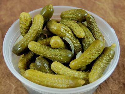 thick and have light insides. Their outsides are a deep green-light green color. They have raised spots / dots on the outside, such as a pickle would.
(They are thicker and shorter with more texture as compared to Slicer Cucumbers)