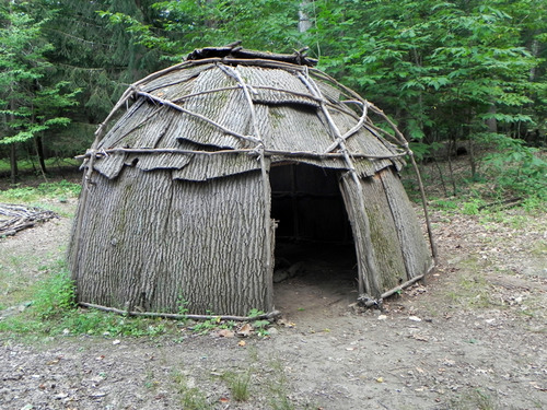 <p>An American Indian dwelling, usually of rounded or oval shape, formed of poles overlaid with bark, mats, or skins.</p>