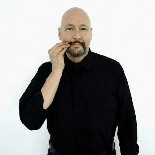 <p><span style="font-size: medium">bringing your fingers and thumb together and touching your cheek near the side of your mouth.&nbsp;Then move your hand an inch or two toward your ear and touch your cheek again.</span></p>