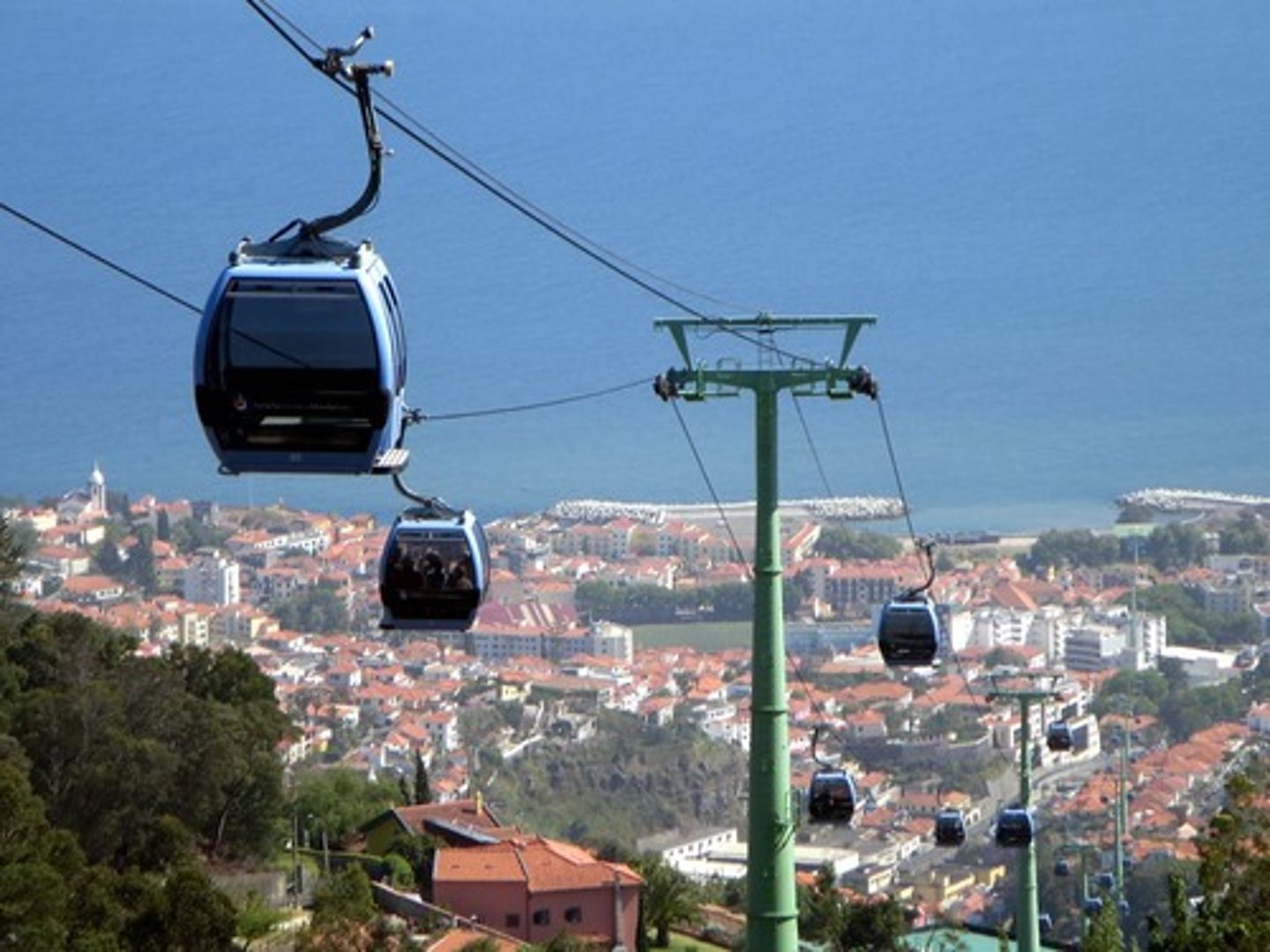 <p>A cable car over a relatively flat landscape</p>