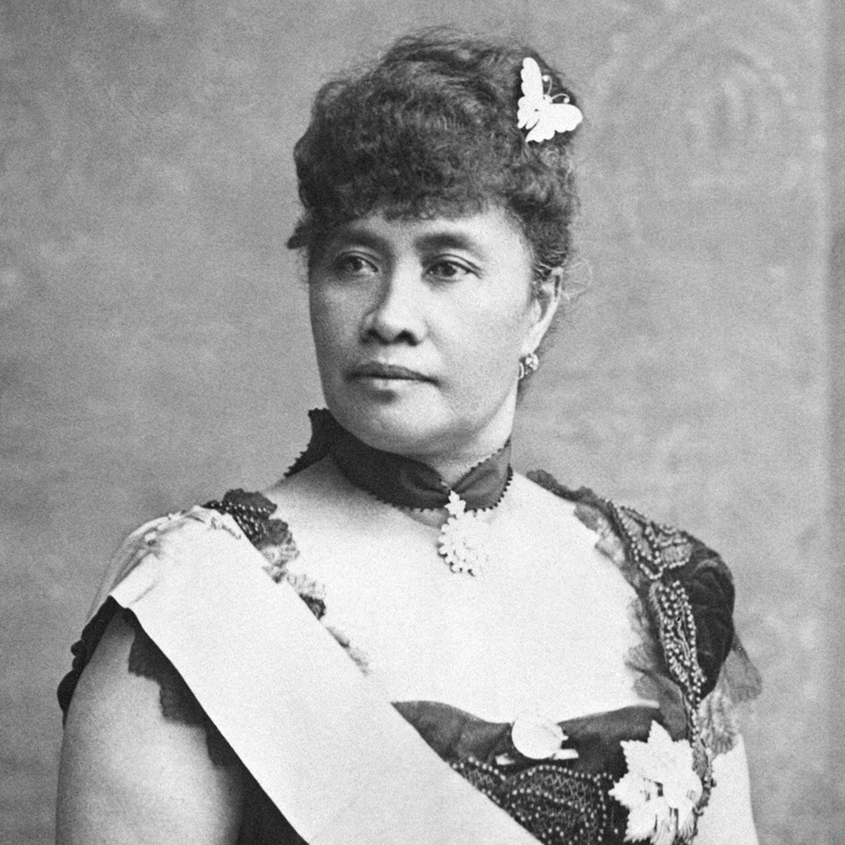 <p>The queen of Hawaii, deposed in an 1893 coup after she tried to make a new constitution replacing the Bayonet Constitution and restoring political power and votes to native hawaiians. She worked to fight annexation by the U.S., restore the power of the monarchy, and reclaim voting rights for her people using nonviolent forms of resistance such as appealing to the laws of the Bayonet Constitution. Most histories of the annexation focused on the accounts of the perpetrators of the coup and English language newspapers, framing her as incompetent using black steryotypes, and minimizing her resistance.</p>