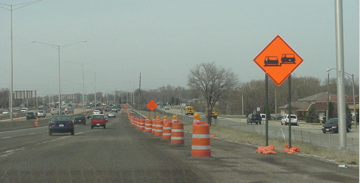 9\. What does this construction zone and sign represent in this picture? 

\
Merge onto highway at your own risk

Passing is NOT allowed

Uneven pavements 

Bus stop