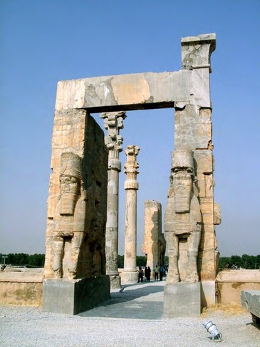 <p>The entrance of the Gate of All Nations was protected by bulls (front) and mythological creatures, called lamasssus, bulls with the head of a bearded man.</p><p>These bull-men originated in Babylonia and Assyria, but the Persians had adopted them.</p><p>The general idea behind these fantasy animals is that they warded off evil, which explains why they were standing at a gate.</p>