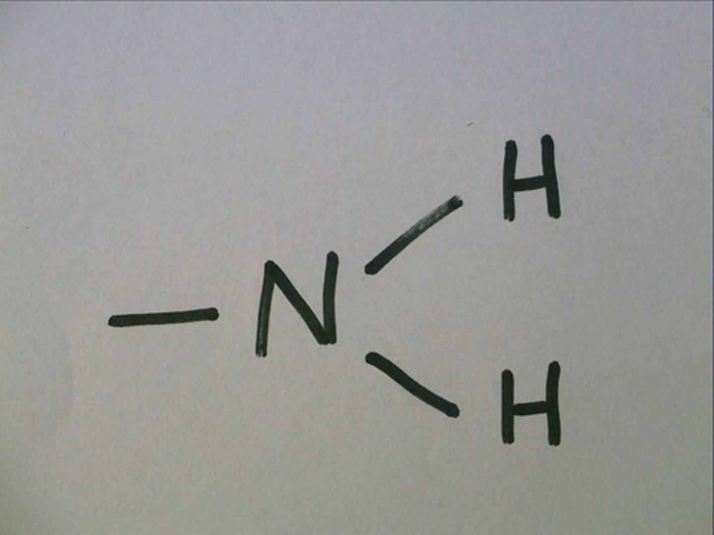 <p>nitrogen bound to 2 hydrogens (H)</p>