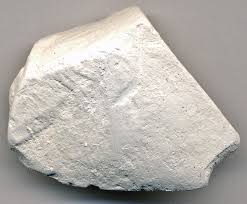 <p>This rock is white in color, breaks off easily, and is fairly soft. Probably a 2.5 or so in hardness. This is a biochemical rock with very fine grain size.</p>