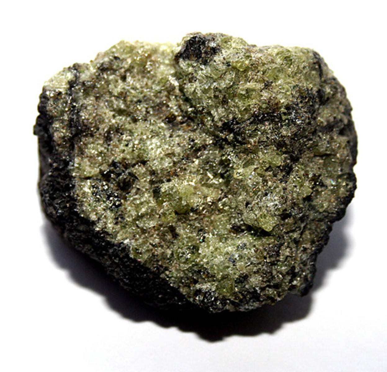 <p>Rock-forming mineral; hardness 6.5-7 (harder than glass), olive to yellow green, vitreous (glassy), granular masses</p>