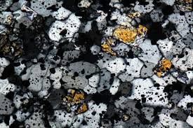 <p>Mosaic of crystals of approximately equal size… without particular orientation.”</p>