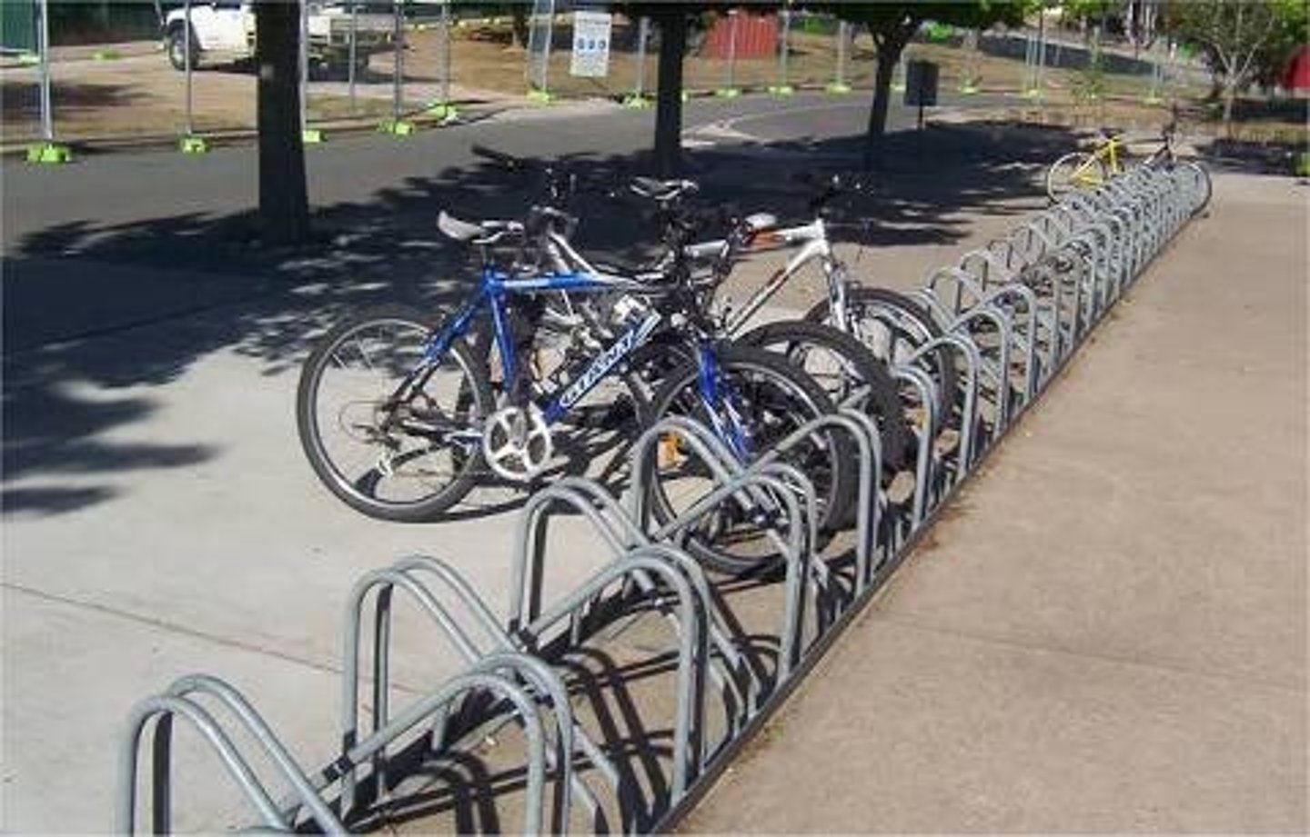 <p>the metal supports where bicycles are parked</p>