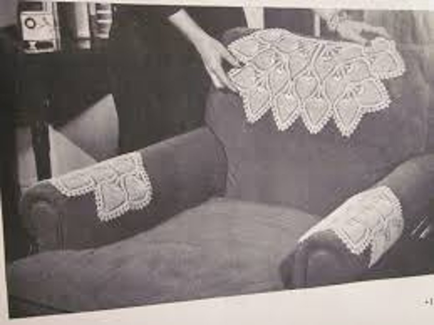 <p>a piece of ornamented cloth that protects the back of a chair from hair oils</p>