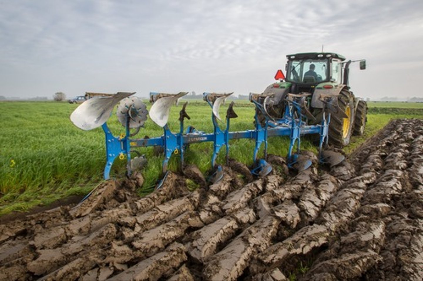 <p>Turning over the soil with a plough to prepare for planting</p>