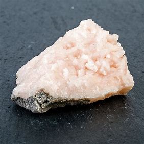 nonmetallic, white streak, excellent cleavage in three directions, light pink color