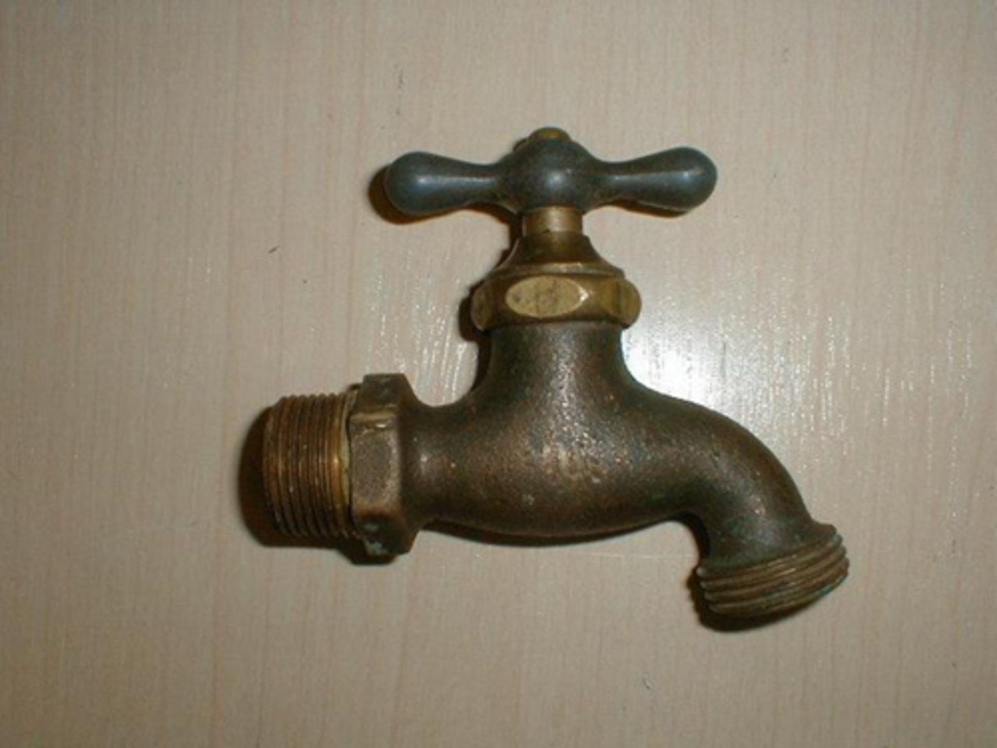 <p>valve for attaching a water hose; turning water supply on or off</p>