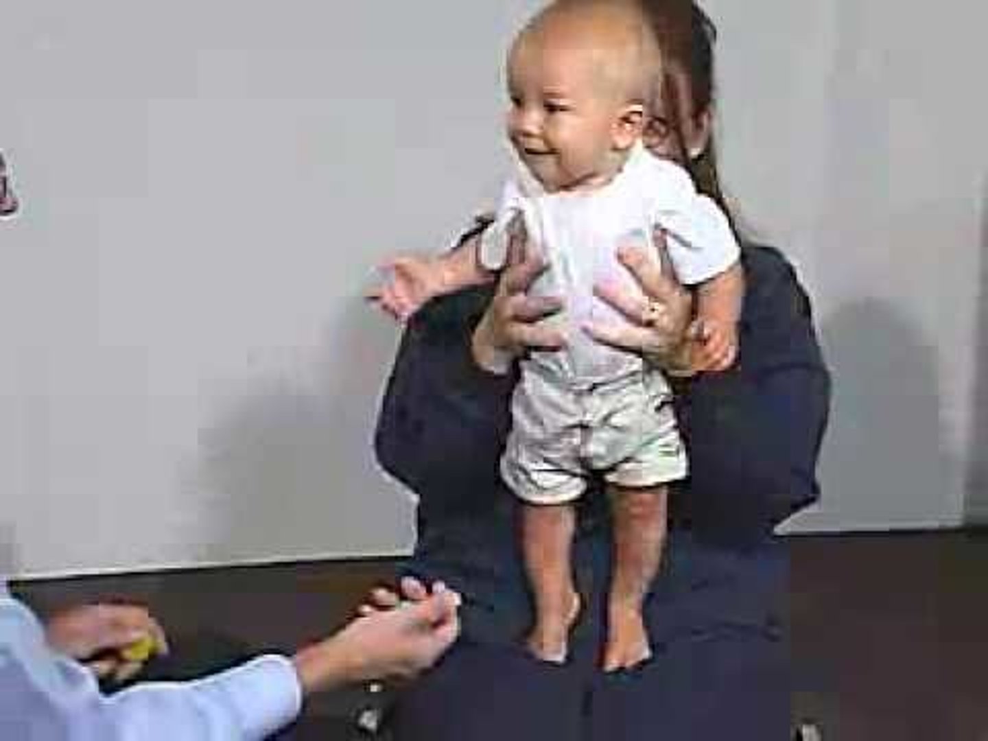<p>baby suspended in vertical with feet touching a solid surface; extension at hips, knees, and ankles and bouncing in attempt to support weight</p>