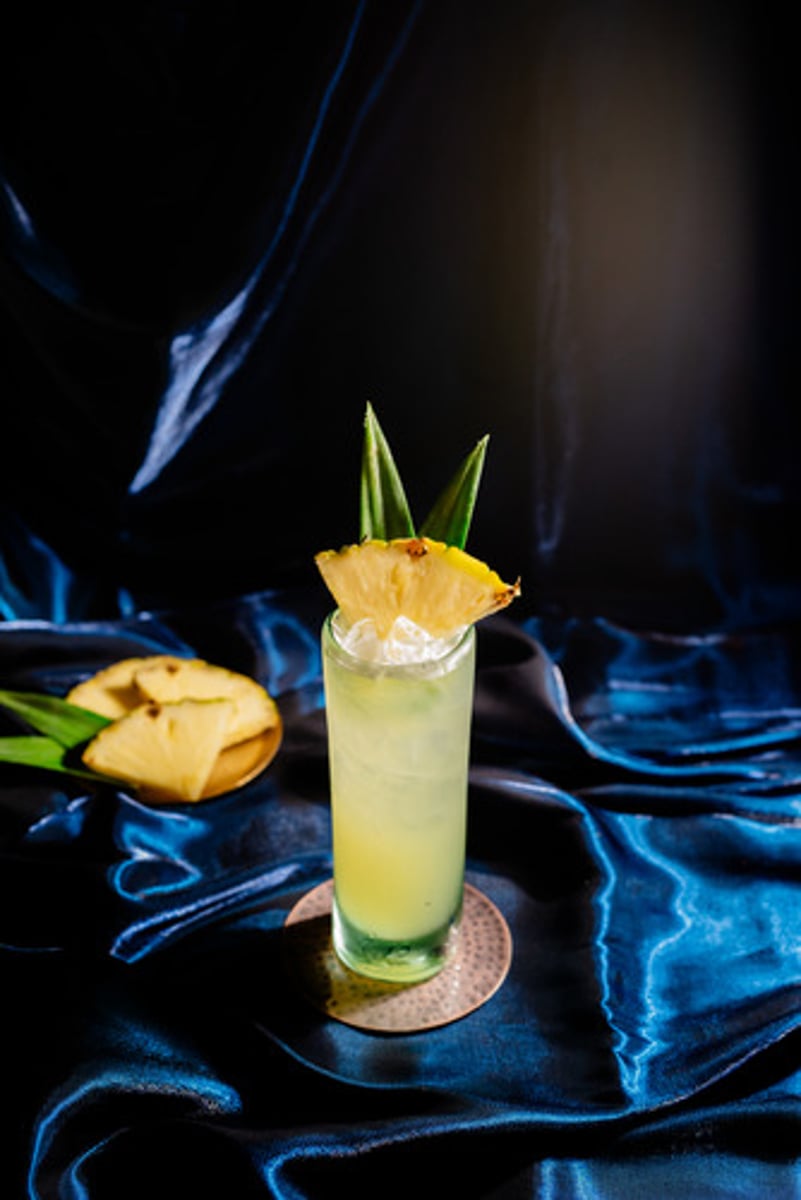 <p>Tapatio Tango</p><p>- Tapatio Blanco tequila</p><p>- House-made roasted piña-serrano syrup</p><p>- Fresh lime juice</p><p>- Agave nectar</p><p>- Cilantro</p><p>- Topo Chico</p><p>Garnish: Pineapple leaves, pineapple wedge</p><p>Flavor profile: Light and refreshing</p><p>Selling description: A refreshing tropical cocktail crafted with mesquite roasted pineapple and serrano.</p><p>** Not available at airport locations.</p>