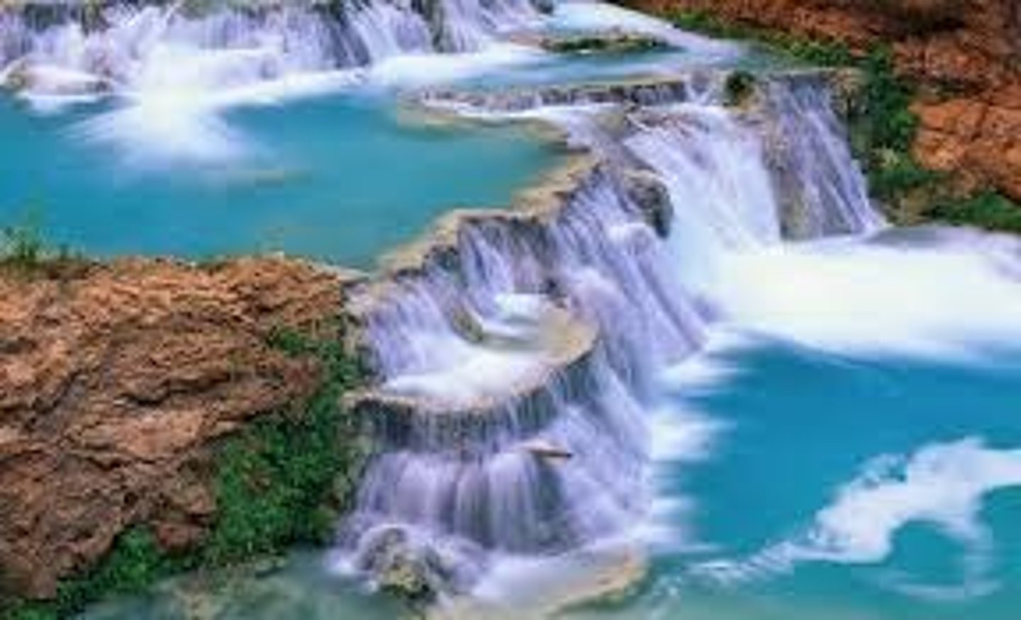 <p>A cascade of water falling from a height, formed when a river or stream flows over a precipice or steep incline.</p>