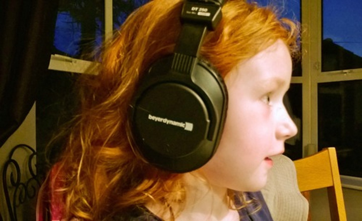 <p>In a way that can be heard ( aud = hear + ly = in a way)</p>