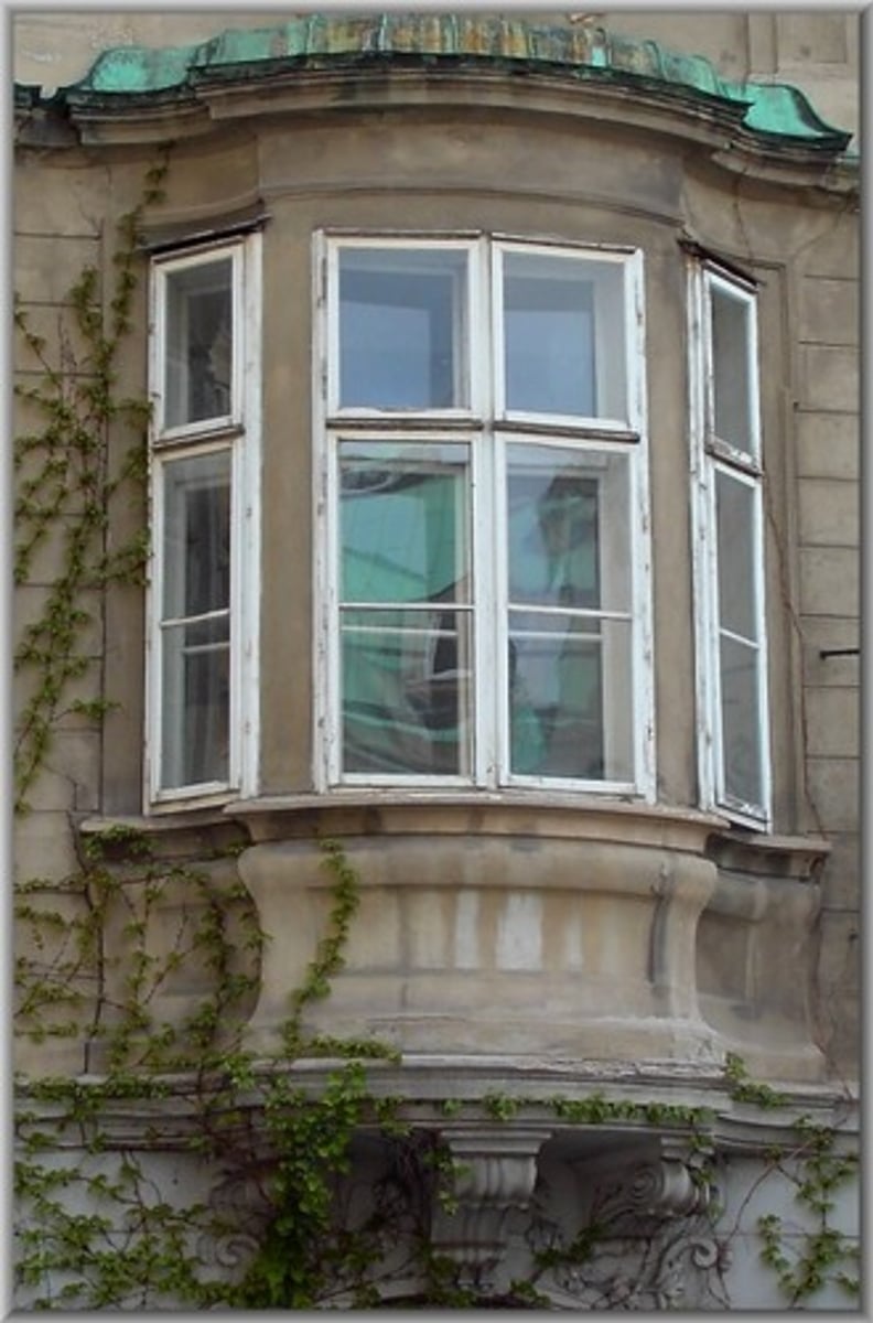 <p>a window projecting from the surface of the wall to allow light from three sides</p>