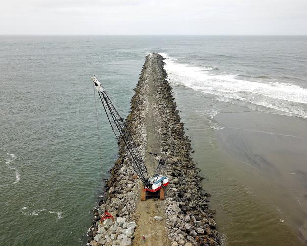 **Jetty** – built next to a tidal inlet to stabilize the location of the inlet 
