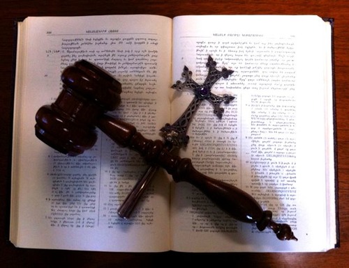 <ol><li><p>place in or regard as belonging to a canon of literary or artistic works.</p></li><li><p>(in the Roman Catholic Church) officially declare (a dead person) to be a saint.</p></li></ol>