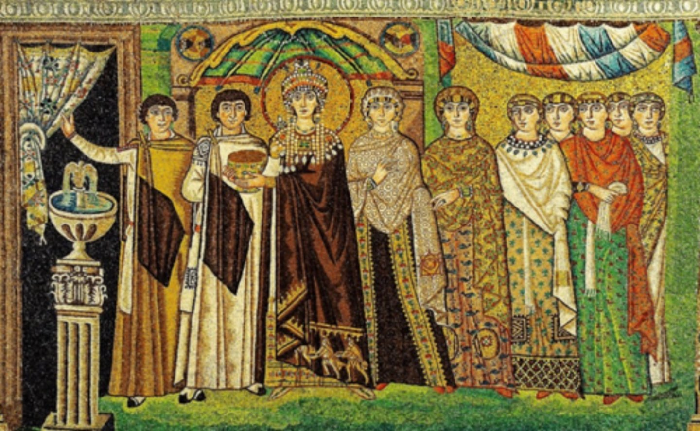 <p>describe the mosaics of Theodora with her court in San Vitale</p>