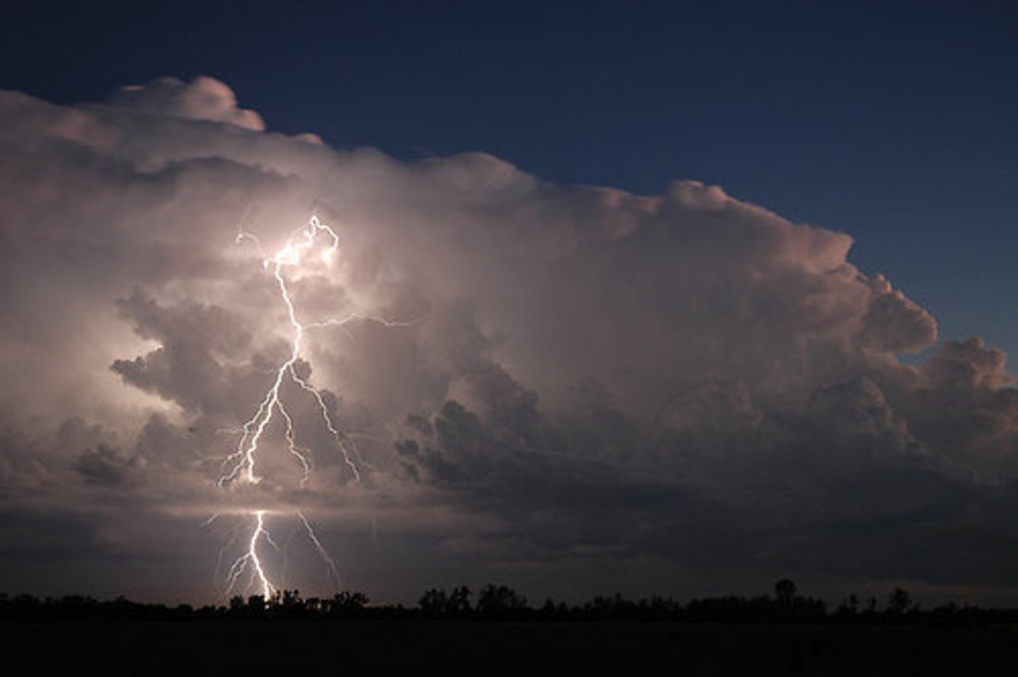 <p>a short, heavy storm that consists of rain, strong winds, lightning, and thunder</p>