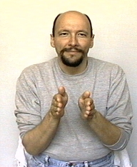 <p><span style="font-size: medium">hold your hands in front of you, palms facing, and then bring them together using a relatively quick movement.</span></p>