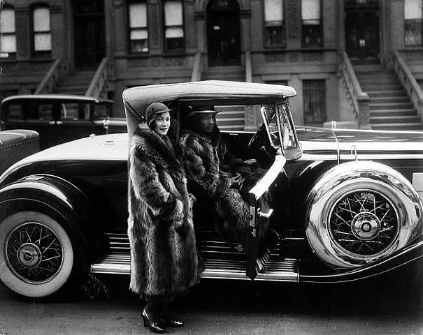 <p></p><p>Harlem Renaissance</p><p>Photo</p><p>Showing wealthy black people showing their wealth</p><p>Fur coats</p><p>Cadillac was a very high-end car for that time</p><p>Wheels were 2 tones in color</p><p>As well, there is a lot of chrome to show wealth</p><p>Showing how black wealth and white wealth is different</p><p>Raccoon fur wasn't a very common type of coat</p><p>Showing because it's a status symbol for their community</p>