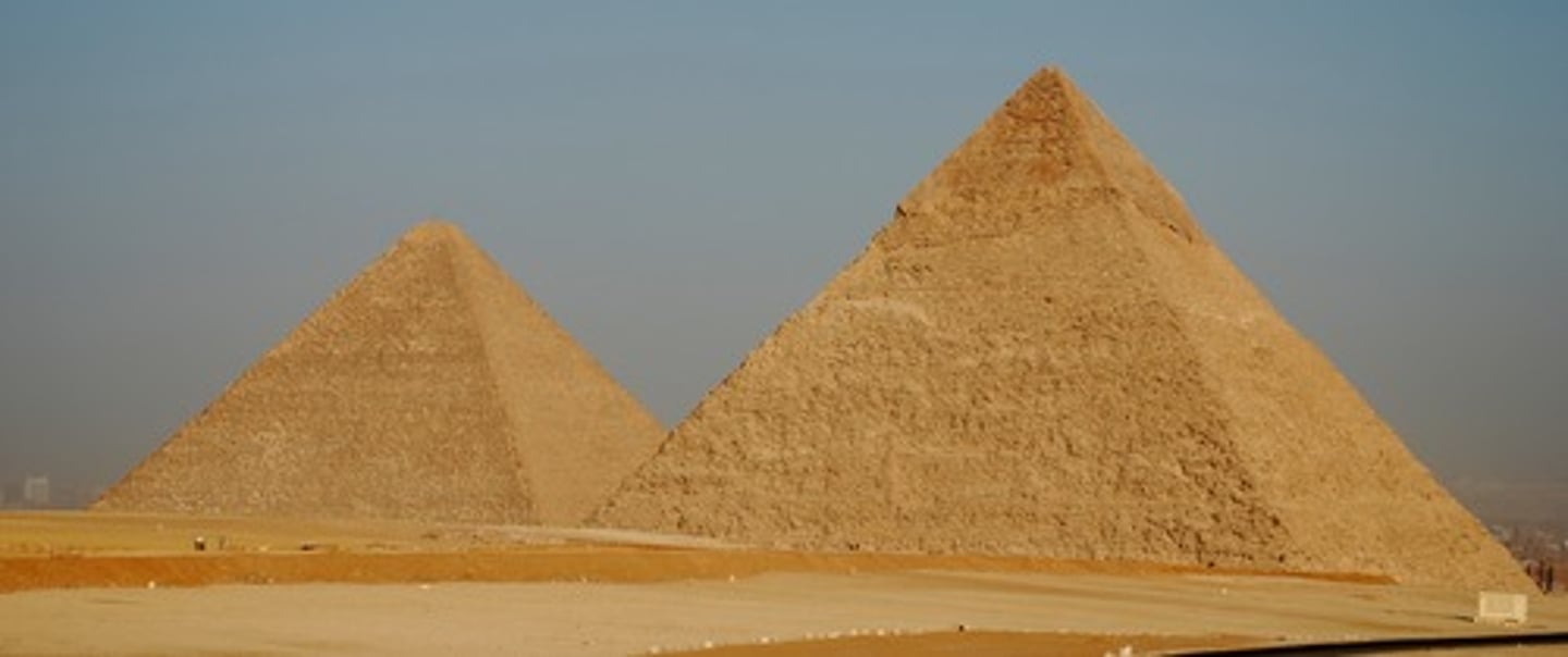 <p>Huge stone tombs with four triangle-shaped walls that met in a point on top</p>