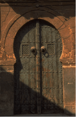 <p>at the door</p>