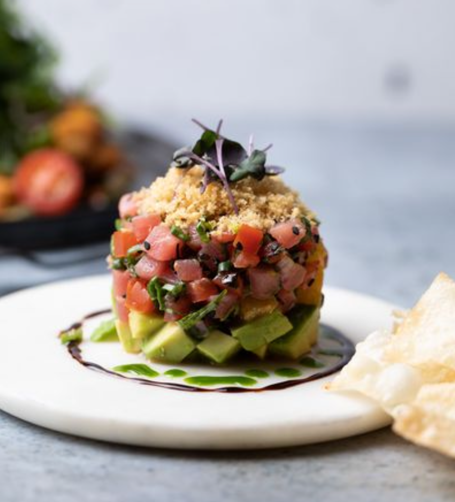 <p><em>Fresh, with great balance of taste and textures</em></p><p>Ingredients: </p><ul><li><p>OceanWise Ahi Tuna (sashimi grade, raw)</p></li><li><p>avocado</p></li><li><p>citrus tamari vinaigrette + glaze </p></li><li><p>black sesame seeds</p></li><li><p>green onion</p></li><li><p>cilantro</p></li><li><p>roma tomatoes</p></li><li><p>crispy tempura</p></li><li><p>shredded nori</p></li><li><p>parsley oil</p></li><li><p>crispy wonton chips</p></li><li><p>black sesame seeds</p><p></p></li></ul><p>Common Allergens: </p><ul><li><p>seafood, wheat, soy, egg, sesame, alcohol, sulphites, celiac, dairy</p></li></ul><p></p>