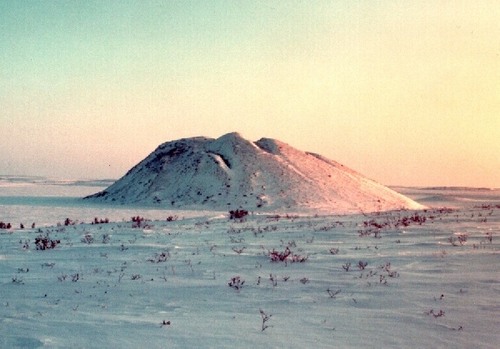 a dome-shaped mound consisting of a layer of soil over a large core of ice, occurring in permafrost areas.