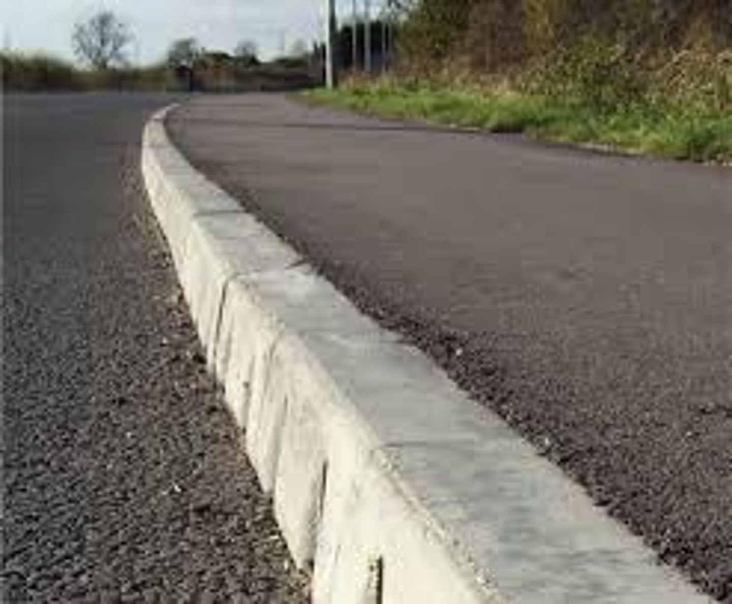 <p>the <strong>edge of a raised path</strong> nearest the road</p>