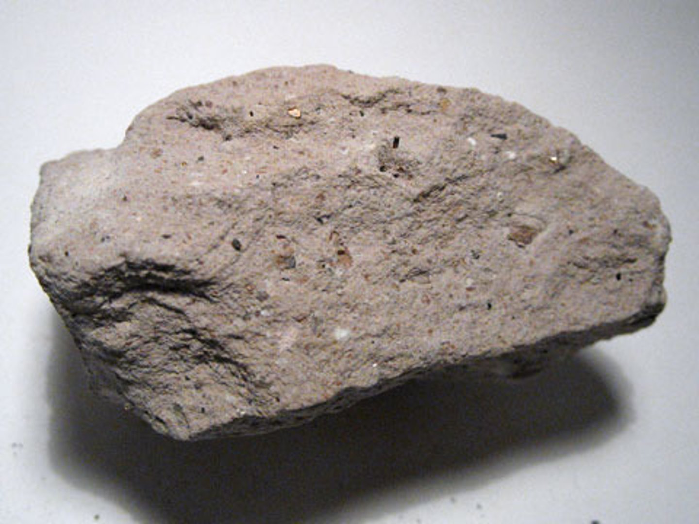 <p>A light-brown to gray, fine-grained extrusive igneous rock with a felsic composition. The extrusive equivalent of granite.</p>