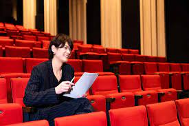 <p><span>A person who analyzes and evaluates films or other things and then writes or records their opinions about them</span></p>