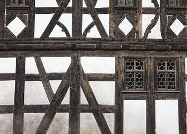 <p>a wall that has timbered framework with the spaces filled with masonry or plaster</p>