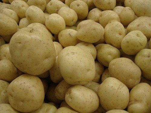 short and round. They are yellow-brown on the outside with few eyes. The skin is thin, with a yellow inside to the vegetable.